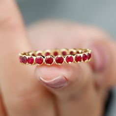 Product Details This Ruby Ring is unique and a beautiful jewelry for your loved ones. It features with Round Cut Ruby in full eternity pattern in Bezel Setting on Eternity Ring. This Full Eternity Ring is crafted in Solid Gold. Either go alone or stack it with other rings, in both the ways it will look flawless. Product Information SKU SHP-RINGS0821169419 Width 1.7 mm Height 3.2 mm Weight 2.40 gm (Approximate) RUBY INFORMATION No.of Stones 21 Pieces Total Weight 2.08 Carat (Approximate) Dimensio Full Eternity Ring, Stackable Ring, Ruby Ring, Stackable Rings, Bezel Setting, Eternity Ring, Round Cut, Beautiful Jewelry, Solid Gold