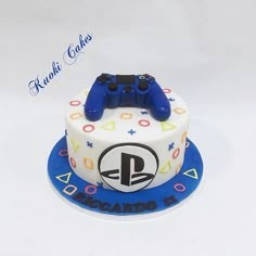 a birthday cake with a video game controller on top