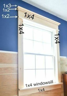 a window with measurements for the top and bottom half of it in front of a blue wall