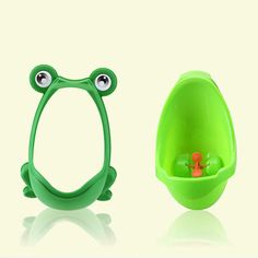 two green frog shaped toys sitting next to each other