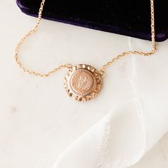 This one-of-a-kind necklace is composed of: Victorian medallion from the late 1800s with the initials "GLB" hand-engraved in the center. This necklace measures a standard 18” on a modern 14k gold filled chain, with the pendant measuring 0.875" in height. Victorian Brass Jewelry With Coin Pendant, Victorian Brass Coin Pendant Jewelry, Victorian Style Medallion Coin Pendant Jewelry, Victorian Necklace With Coin Pendant For Formal Occasions, 14k Gold Medallion Jewelry, Elegant 14k Gold Medallion Necklace, Heirloom Coin Pendant Jewelry, Formal 14k Gold Engraved Initial Necklace, Engraved Yellow Gold Initial Necklace For Formal Occasions