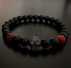 Skull bracelet. All our beads/ stones are carefully selected individually to give you the best quality Please select your wrist size and we will ensure to achieve the best fit for you.  In order to obtain superior strength, we then use silicon stretch cord.  Your bracelets will come in a black leather pouch Handmade Skull Bracelet As A Gift, Adjustable Skull Bracelet As Gift, Adjustable Skull Bracelets As Gift, Adjustable Skull Wristband Gift, Skull Shaped 8mm Bead Jewelry Gift, Bracelet Gift Ideas, Gift Ideas Anniversary, Skull Bracelet Men, Men Bracelet