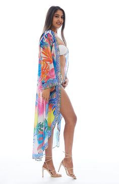 Charm your festival or beach look with this lightweight duster covered in a vibrant flamingo pattern. Open front Kimono-inspired sleeves
 100% polyester
 Hand wash cold, lay flat to dry
 Imported Model stats: 5'10", 32" bust, 25" waist, 36" hip. Model is wearing size One Size. Tropical Long Sleeve Cover-up For Beach Season, Spring Tropical Print Cover-up For Poolside, Multicolor Long Sleeve Cover-up For Beach Season, Multicolor Long Sleeve Beach Cover-up, Multicolor Long Sleeve Cover-up For Beach Party, Long Sleeve Multicolor Beach Cover-up, Trendy Multicolor Beach Cover-up, Summer Long Sleeve Multicolor Cover-up, Summer Multicolor Long Sleeve Cover-up