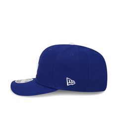 This Los Angeles Dodgers Blue Adjustable Hat features a front embroidered team logo on a structured polyester crown with pre-curved visor, inner stretch sweatband, and adjustable closure. New Era Evergreen 9SEVENTY Stretch Snap Front embroidered team logo Left embroidered New Era logo Snapback closure Featherweight Polyester Curved Bill High Crown Structured Breathable Snapback Hat For Baseball Season, Collegiate Baseball Cap For Sports, Sports Snapback Hat With Embroidered Logo And Curved Visor, Adjustable Snapback Baseball Cap With Embroidered Logo, College Snapback Hat With Curved Visor For Baseball Season, Embroidered Logo Snapback Baseball Cap With Adjustable Fit, Curved Visor Snapback Hat For College Baseball Season, Team-colored Adjustable Baseball Cap For Fans, Adjustable Team-colored Baseball Cap For Fans