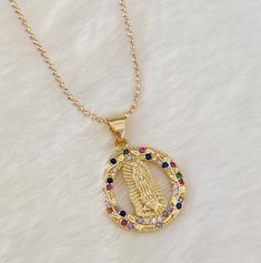 "18k Gold filled Our lady of Guadalupe necklace MATERIAL AND SIZE: 18k Gold filled chain Cubic Zirconia pendant Medal size: 2cm Length: 16\" or 18\". If you need other length, feel free to reach me out. If you have questions about the product, feel free to reach me out. Don't forget to check out my other items in the store: Https://www.etsy.com/shop/nyahwithlove" Spiritual Jewelry: Our Lady Of Guadalupe Round Pendant, Spiritual Our Lady Of Guadalupe Pendant Necklace, Gold Virgin Mary Pendant Necklace, Spiritual Yellow Gold Our Lady Of Guadalupe Jewelry, Gold Medallion Necklace With Our Lady Of Guadalupe, Gold Medallion Necklace Of Our Lady Of Guadalupe, Gold Our Lady Of Guadalupe Pendant Necklace, Gold Our Lady Of Guadalupe Medallion Necklace, Gold Our Lady Of Guadalupe Round Pendant Necklace