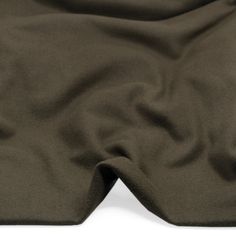 Made from a cozy blend of wool & nylon, this deadstock felted coating is a surefire pick for all kinds of lined and unlined coats or jackets. With a structured drape, this medium weight coating is thick & warm with a beautiful soft hand. Easy to sew, it also boasts a minimal fray edge that would work well for a raw finish.This fabric has been sustainably sourced from a deadstock fabric supplier. For a professional finish, pair with our solid Bemberg Cupro Linings. Gütermann Thread Match: #580 Bitter Chocolate Content: 80% Wool / 20% Nylon *Exact contents cannot be guaranteed Width: 147cm / 58”Weight: 434gsm / 12.8ozOpacity: OpaqueDrape: StructuredCountry of Origin: Italy Share your makes with #BFWool, #BFDeadstock, and #BlackbirdFabrics! Deadstock Fabric, Bitter Chocolate, Easy To Sew, Fabric Suppliers, Fall Favorites, Felted Wool, Soft Hands, Soft Hand, Black Bird