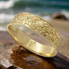 This Bangle Bracelet Features A Beautiful Honu And Floral Design. It Is Considered Medium To Heavy Weight. Very Comfortable To Wear, And Sturdy To Hold Its Shape. This Bracelet Is 15mm Wide. Jewelry Gold Bracelet, Hawaiian Bracelets, Hawaiian Jewelry, Jewelry Beach, Gold Armband, Floral Bracelet, The Bangles, Beach Jewelry, Jewelry Gold