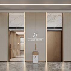 an elevator with marble walls and flooring next to a white trash can on the ground