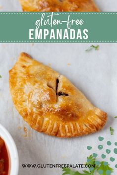 two pieces of empanadas sitting on top of a piece of paper