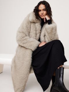 Cut with a tailored silhouette in a midi length, this warm coat is crafted in a faux fur fabric we selected for its incredible softness and warmth.  Warmest: Fully lined for maximum warmth.  Relaxed fit.  Point collar.  Button front closure.  Two front and one internal pocket.  Fully lined. Winter Coat Style, Faux Fur Long Coat, Fur Long Coat, Medium Tv Show, Long Faux Fur Coat, Winter Fashion Coats, Coat Style, Fur Fabric, Technology Fashion