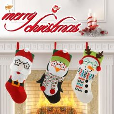 three christmas stockings hanging from a fireplace with the words merry christmas written in red and green