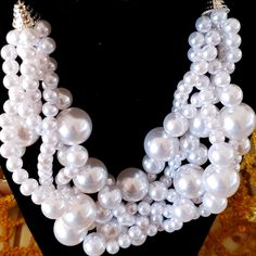 White Pearl Cluster Necklace. Chic White Handmade Necklace, White Pearl Bib Necklaces For Party, White Pearl Bib Necklace For Party, White Pearl Chain Jewelry For Party, Chic White Pearl Necklace For Party, Elegant White Pearl Bib Necklace, Chic White Beaded Pearl Necklace, Chic White Pearl Jewelry, White Pearl Beaded Necklaces For Party