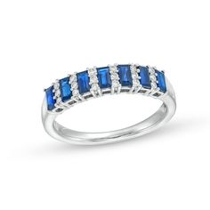 Update your look with the easy sophistication of this alternating baguette-cut blue sapphire and diamond trio band in white gold. Crafted in 14K white gold Channel-set baguette-cut bright blue sapphires alternate with linear trios of sparkling diamonds. This band shines with 1/8 ct. t.w. of diamonds. Timeless Blue Jewelry With Baguette Diamonds, Classic Silver Sapphire Ring With Baguette Diamonds, Sapphire Ring With Baguette Diamonds, Fine Jewelry Sapphire Ring With Baguette Diamonds, Classic White Gold Sapphire Ring With Baguette Diamonds, Baguette Cut Sapphire Ring With Diamond Accents, Blue Sapphire Ring With Channel Set Baguette Cut, Blue Sapphire Baguette Cut Channel Set Ring, Blue Sapphire Baguette Cut Ring Channel Set