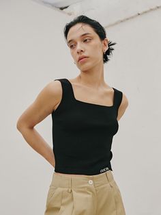 This is ODER’s sleek sleeveless knit top, tailored for a refined look. With its stretchy fabric, it offers comfortable wear, making it perfect for standalone styling with its basic design.- Perfect for daily wear, providing both comfort and style- Ideal for pairing with different styles of bottoms- Its clean style effortlessly complements any look- The brand logo embroidered at the bottom front adds a subtle touch of sophistication Black Sleeveless Breathable Jersey, Stretch Sleeveless Tank Top With Built-in Padding, Black Breathable Sleeveless Jersey, Sleeveless Sportswear Top With Built-in Padding, Black Sleeveless Tank Top With Smoothing Details, Sleeveless Knit Top, Sleeveless Knit, Basic Design, Stretchy Fabric