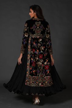 Editor's Note Black Silk Velvet Split Anarkali, Attached Crinkled Ghera Comes With Dupatta & Churidar Color: Black Fabric: Silk Velvet & Cotton Care: Dry Clean Only About the Designer Rohit Bal is intensely concerned with design as an art form. The designer draws on history, fantasy and folklore to create masterpieces that are desired by discerning aficionados around the globe. Rohit has a deep understanding of the psyche of the fashion world and it reflects in his collections that are intellige Velvet Anarkali, Casual Bridal Dress, Black Anarkali, Long Jackets For Women, Embroidered Anarkali, Velvet Dress Designs, Rohit Bal, Bridal Dress Fashion, Dresses Indian