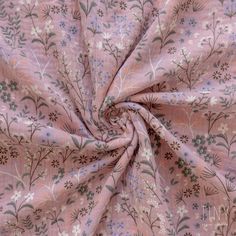 the fabric is pink and has flowers on it