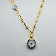 MOONSTONE DIAMONDS SAPPHIRES TURQUOISE SUN SYMBOL GOLD NECKLACE Luxury Yellow Gold Turquoise Necklace, Luxury Round Cabochon Necklace, Gold Gemstone Round Chain Necklace, Gold Plated Gemstone Round Pendant Necklace, Gold Turquoise Pendant Necklace In Sterling Silver, Gold Cabochon Pendant Necklace, Gold Gemstone Chain Necklace, Gold Pendant Necklace With Cabochon, Gold Plated Charms Necklace With Round Shape