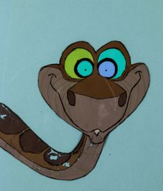 a close up of a cartoon snake with big eyes