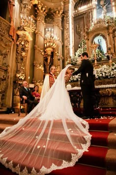 the bride and groom are getting ready to walk down the aisle