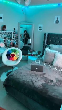 a bed room with a laptop on top of it