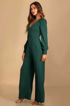 Special days call for a special piece like the Lulus Celebrating Romance Emerald Green Long Sleeve Wide-Leg Jumpsuit! Stretchy crepe knit shapes this jumpsuit that has a V-neckline and long sleeves with button cuffs and slightly puffy shoulders. A darted bodice tops a banded waist and flowy wide legs. Hidden back zipper/clasp. Fit: This garment fits true to size. Length: Floor length. Size medium measures 58.75" from shoulder to hem. Inseam: 30.75 Front Rise: 13.50 Bust: Great for any cup size. Fancy Romper Long Pants, Green Jumpsuit Outfit, Wedding Guest Jumpsuit, Green Wedding Guest Dresses, Emerald Green Jumpsuit, Jumpsuit Outfit Wedding, Jumpsuit Lulus, Jumpsuit Wedding Guest, Jumpsuit Winter