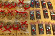 christmas favors are laid out on a table with red bows and ribbon around the cookies