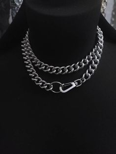 Make an edgy statement with this stunning Chunky Chain Goth Choker Layered Necklace Set! Crafted with steel curb chain and stainless steel push clasp, this modern and sophisticated necklace comes with a bit of punk rock edge, perfect to challenge your style. Light up any outfit and rock the night away! Wear long or doubled as a choker. Total length end-to-end is approximately 32 inches. Cheap Punk Choker For Festivals, Gothic Metal Jewelry With Chain Strap, Punk Style Metal Double Chain Necklace, Punk Style Double Chain Link Jewelry, Edgy Metal Jewelry With Chain Strap, Edgy Double Chain Link Jewelry, Edgy Double Chain Link Necklace, Double Chain Metal Necklaces With Cuban Link, Punk Style Gunmetal Chain Jewelry