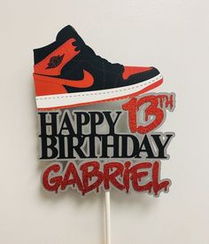 a birthday cake topper with a shoe on it