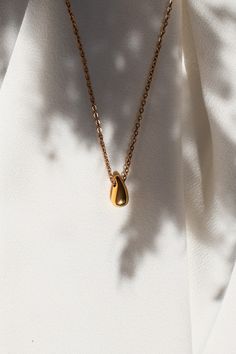 "Beautiful Waterdrop Minimalist 18k Gold Plated Necklace.  Stainless steel jewellery perfect for daily wear or as a gift. Waterproof, tarnish free and hypoallergenic properties make it perfect for the sensitive skin. * DETAILS * 18k gold plated PVD over stainless steel. Length of the necklace is 42cm with 5cm extension.  Width: 10. Height: 12mm. * SHIPPING * FREE UK tracked shipping with all the orders posted the next day. * PACKAGE * Each order comes in the beautiful KOTI bag, perfect for gifti Necklace Product Photography, Jewellery Photography Inspiration, Jewellery Photography, Skin Details, Jewellery Gifts, Waterproof Jewelry, Everyday Necklace, Jewelry Photography, Lovely Necklace