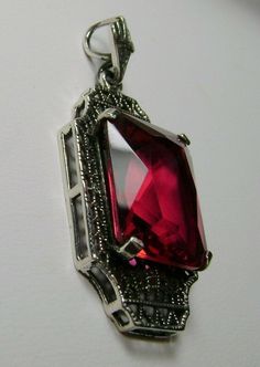 "Simulated Red Ruby Pendant Lantern Design#P13 Custom Made This beautiful pendant is fashioned from a lovely Art Deco brooch. This lovely antique style pendant is hand-crafted in solid sterling silver. The flawless simulated 9 carat red ruby is 15mm x 12mm. The pendant is 1-3/8\" long and 9/16\" wide. The bail opening is 3.5mm wide and will thus fit any chain of 3mm or less. The chain (if chosen) is adjustable between 18-20\". The lantern shaped filigree creates a beautiful backdrop for the vibr Classic Red Hallmarked Necklace, Classic Evening Ruby Jewelry, Ornate Red Pendant Jewelry, Classic Red Pendant Necklace, Vintage Ruby Jewelry For Parties, Vintage Ruby Evening Jewelry, Victorian Ruby Necklace For Formal Occasions, Antique Ruby Necklace For Formal Occasions, Red Victorian Necklace For Anniversary