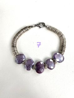 Purple Bohemian Bracelet For Everyday, Purple Bohemian Everyday Jewelry, Purple Bohemian Bracelet For Everyday Wear, Bohemian Purple Stretch Bracelet With Faceted Beads, Adjustable Lavender Bracelets With Spacer Beads, Adjustable Lavender Jewelry For Everyday, Adjustable Stackable Rondelle Stretch Bracelet, Everyday Purple Round Beaded Bracelets, Adjustable Purple Stretch Bracelet With Faceted Beads