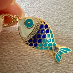 "Great workmanship, bright colors, quality material.  Pendant is covered with shiny enamels. Made with 925 sterling silver. Fish pendant does not cause allergies and does not contain nickel. Fish necklace is gold-color because it is plated on silver. A sparkling gift option for your ocean-lover friends on Christmas. If you love fish, you can take a look here for different options. https://www.etsy.com/shop/NNGJewellery?section_id=46434843 Material : 925 ct silver, enamel Weight : 2.8 gr Fish Size :  22 mm x 12 mm. Colors : Gold Gemstone : Zircon. Chain colors : Gold Chain size:  16\" + 2 '' (40cm + 5 cm) , 18'' + 2'' (45 cm + 5 cm) They will come with a gift box. All orders will be shipped out within 1-2 business days after the order has been received. Shipping : Standard Shipping usually Christmas Gift Mom, Gift For Bff, Sparkle Gift, Animal Necklace, Fish Necklace, Fish Pendant, Silver Fish, Nautical Jewelry, Enamel Necklaces