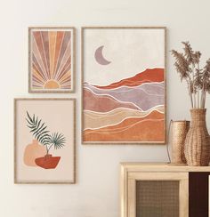 three framed art pieces hang on the wall above a dresser