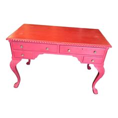 a pink desk with two drawers on it