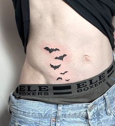 a woman's stomach with bats on it