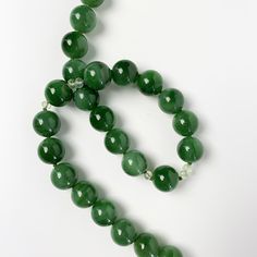 Excellent translucence, has some iron concentrations Green Jade Spiritual Necklace, Spiritual Green Jade Necklace, Spiritual Jade Crystal Necklaces With Round Shape, Green Jade Emerald Necklace With Polished Beads, Green Emerald Necklace With Polished Jade Beads, Green Round Gemstone Crystal Necklace, Green Gemstone Round Crystal Necklace, Green Jade Crystal Necklace With Natural Stones, Green Gemstone Crystal Necklace With Round Shape