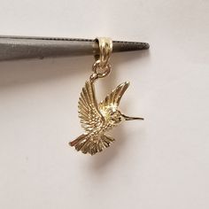 "Thanks for shopping our vintage estate store. We tend to sell well below wholesale and truly hope you enjoy all of our items. Many of the items are one of a kind, so please enjoy scrolling through the pictures and hopefully something will catch your eye. Nice estate 10k yellow gold hummingbird flower charm or pendant. Just stunning. Length: 3/4\" Width: 1/2\" Weight: 0.75 gram Bail: 2mm Sweet pendant and marked 10k. Love the detail." Gold Hummingbird, Hummingbird Jewelry, Black Hills Gold Jewelry, Hummingbird Necklace, Hummingbird Flowers, Heart Anklet, Gift Inspo, Black Hills Gold, Yellow Gold Chain