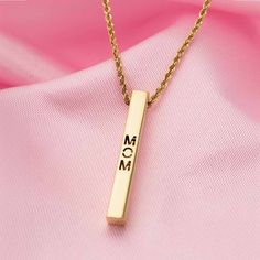 This Best Mom Necklace in 9K Gold is a stunning tribute to the unconditional love of motherhood. Crafted in 9K gold, the bar necklace design is both elegant and sentimental. Perfect for any occasion, this necklace is sure to make any mom feel cherished and appreciated.Weight 2.39 gramsSize 20 inches Personalized Bar Necklace As Gift, Elegant Rectangular Pendant Name Necklace For Anniversary, Elegant Rose Gold Bar Necklace For Gift, Elegant Rose Gold Bar Necklace Gift, Minimalist Name Necklace For Mother's Day Anniversary, Rectangular Name Necklace For Mother's Day Anniversary, Minimalist Name Necklace For Anniversary And Mother's Day, Minimalist Bar Necklace For Mother's Day Personalized Gift, Elegant Rectangular Name Necklace For Mother's Day