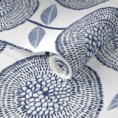 blue and white wallpaper with an abstract design