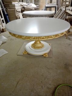 a large white table with gold trim on it