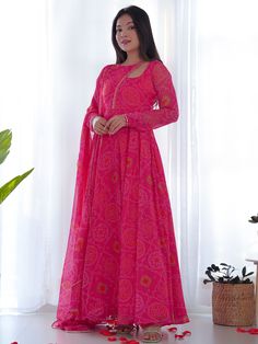 Introducing our stunning pink bandhani printed chiffon gown with dupatta, the perfect outfit for any festive occasion! This beautiful pink gown features intricate bandhani print work, giving it a traditional yet elegant look. The chiffon material adds a touch of sophistication, making you stand out at any event.
This gorgeous gown include its fully stitched design, making it hassle-free to wear. The matching chiffon dupatta with bandhani print work and fancy lace work adds an extra touch of glam Silk Anarkali Gown, Bandhani Suit, Flair Gown, Chiffon Anarkali, Gotapatti Work, Pink Anarkali Suits, Bandhej Print, Pink Anarkali, Kurti Sets