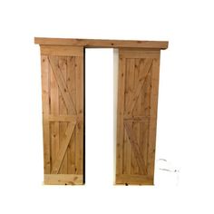 two wooden doors are open on a white background