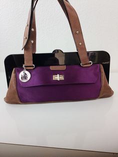 Vintage Lanvin Bag black acrylic frame purple satiny material  brown leather with double straps, adjustable exterior pocket at front with twist lock back exterior pocket with zipper magnet closure in frame silver lanvin logo charm on chain Great vintage condition, small spot at bottom 7 tall 14.5 with straps 14.5 wide All sales are final Luxury Purple Shoulder Bag For Formal Occasions, Designer Purple Evening Bags, Luxury Purple Formal Shoulder Bag, Luxury Purple Bags With Leather Handles, Designer Purple Shoulder Bag With Detachable Handle, Purple Shoulder Bag With Silver-tone Hardware For Evening, Designer Purple Shoulder Bag For Everyday, Designer Purple Shoulder Bag For Evening, Purple Satchel With Silver-tone Hardware