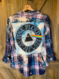 Artfully distressed, upcycled and sustainable flannel shirt paired with upcycled tee with graphic. This flannel is a women's in style but sourced from a variety of brands so resized for a roomy fit.  All one of kind and unless noted, flannel is medium weight.  Show your love with a unique piece that only you will have. Trendy Relaxed Fit Flannel Shirt, Upcycle Band Shirts, Trendy Flannel Shirt For Spring, Trendy Spring Flannel Shirt, Oversized Flannel Spring Tops, Spring Oversized Flannel Top, Oversized Flannel Top For Spring, Trendy Cotton Flannel Shirt For Spring, Tie Dye Cotton Tops For Fall