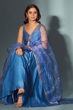 Blue chanderi anarkali with pleated flare and leaf neck. Paired with cotton gathered churidar, organza dupatta with all over butti pattern zari and sequin embroidery.
Components: 3
Pattern: Embroidered
Type Of Work: Zari and Sequin Work
Neckline: Leaf Neck
Sleeve Type: Sleeveless
Fabric: Anarkali: Chanderi, Lining: Mulmul, Churidar: Cotton, Dupatta: Organza
Color: Blue
Other Details: 
Round back
Attached lining
Occasion: Mehendi and Haldi,Puja - Aza Fashions Chanderi Anarkali, Blue Anarkali, Lehenga Saree Design, Dresses Traditional, Desi Fashion Casual, Women Kurta, Indian Dresses Traditional, Cotton Dupatta, Sequin Embroidery