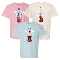 Experience nostalgia with our 'Vintage Soda With Bow' T-Shirt! Celebrate your love for classic soda brands with this charming tee, complete with a bow for a touch of whimsy. Perfect for a day out or a cozy night in, this shirt is sure to become a favorite in your wardrobe. Vintage Cotton T-shirt As Gift, Vintage Short Sleeve Tops For Gift, Retro Short Sleeve T-shirt For Gifts, Retro Short Sleeve T-shirt As Gift, Retro Short Sleeve T-shirt As A Gift, Vintage White T-shirt As Gift, Retro Short Sleeve Tops As Gift, Vintage Crew Neck Top As Gift, Vintage Soda