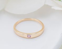 14K Gold-plated baby ring featuring a simple band and a pink CZ stone for October Birthstone. This ring is made with sterling silver and plated with 14K gold plating. This makes a special keepsake baby gift or wonderful birthday gifts for toddlers, kids, children. Great pinky ring as well and comes in a beautiful black velvet heart-shaped box. Ring Sizing: https://cherishedmomentsshop.com/pages/sizing-charts Gifts For Toddlers, Baby Ring, Gold Pinky Ring, Keepsake Baby Gifts, Baby Rings, Simple Band, Kids Rings, Velvet Heart, Box Ring