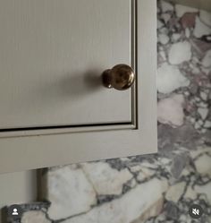 a close up of a cabinet with a knob on it