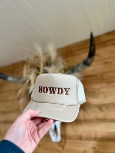 Embrace the rugged charm of the Wild West with our HOWDY Tan Trucker Hat. Expertly crafted for those who appreciate timeless style and enduring comfort, this hat is a must-have for any western wardrobe. Its breathable mesh back ensures a cool and comfortable fit, perfect for sunny days out on the ranch or casual afternoon strolls. With a bold 'HOWDY' embroidered on the front, it's more than just a hat – it's a statement. Shop the collection today at Big Country's Western Wear. Country Trucker Hats, Western Wardrobe, Cowboy Shop, Modern Cowboy, Big Country, The Wild West, Country Western, The Ranch, Days Out