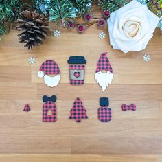 christmas decorations are arranged on a wooden floor